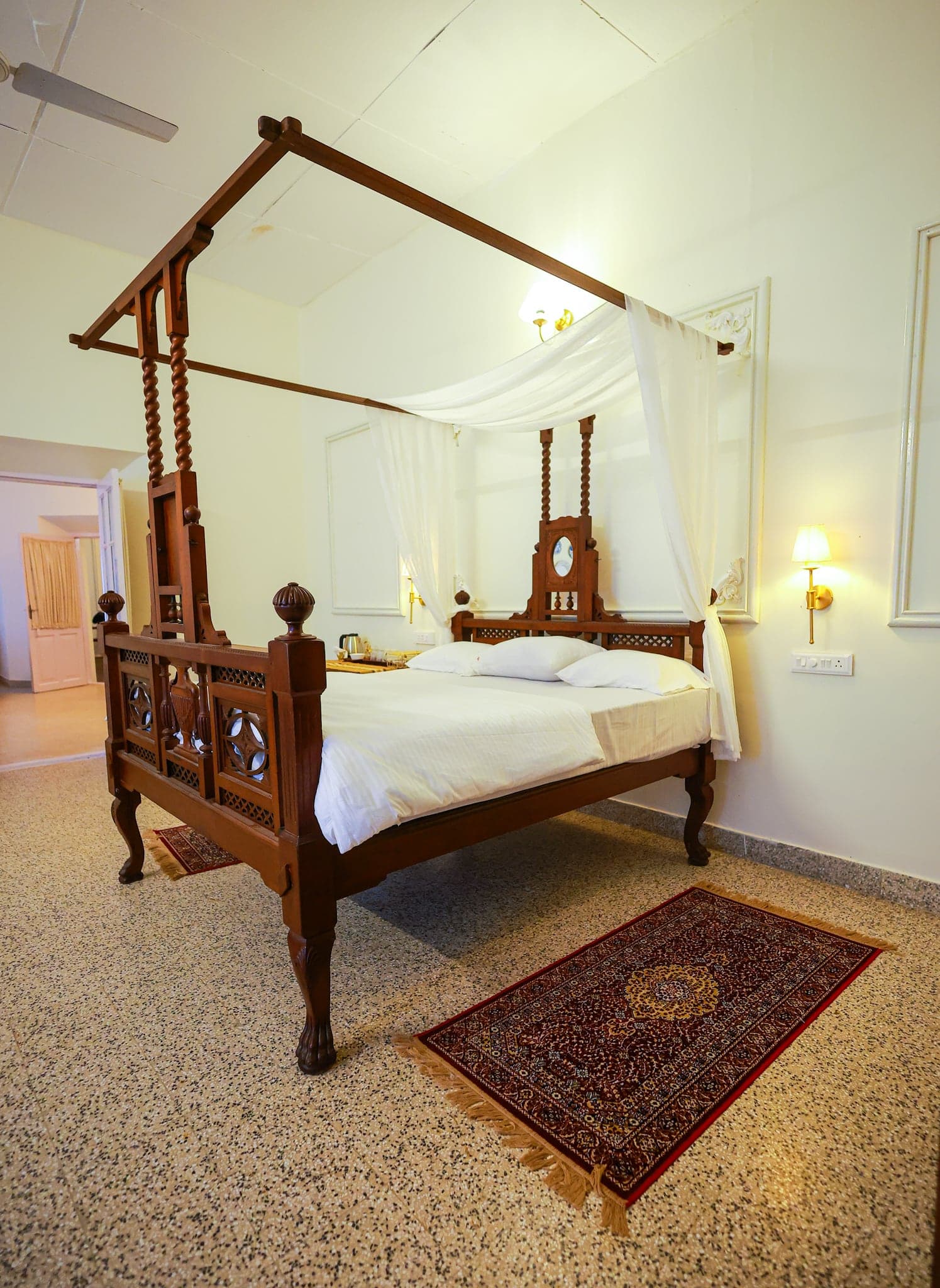 Antique four-poster bed and planter-era furniture at Heyday Planter's Portico, near Thenmala, Kollam, Kerala