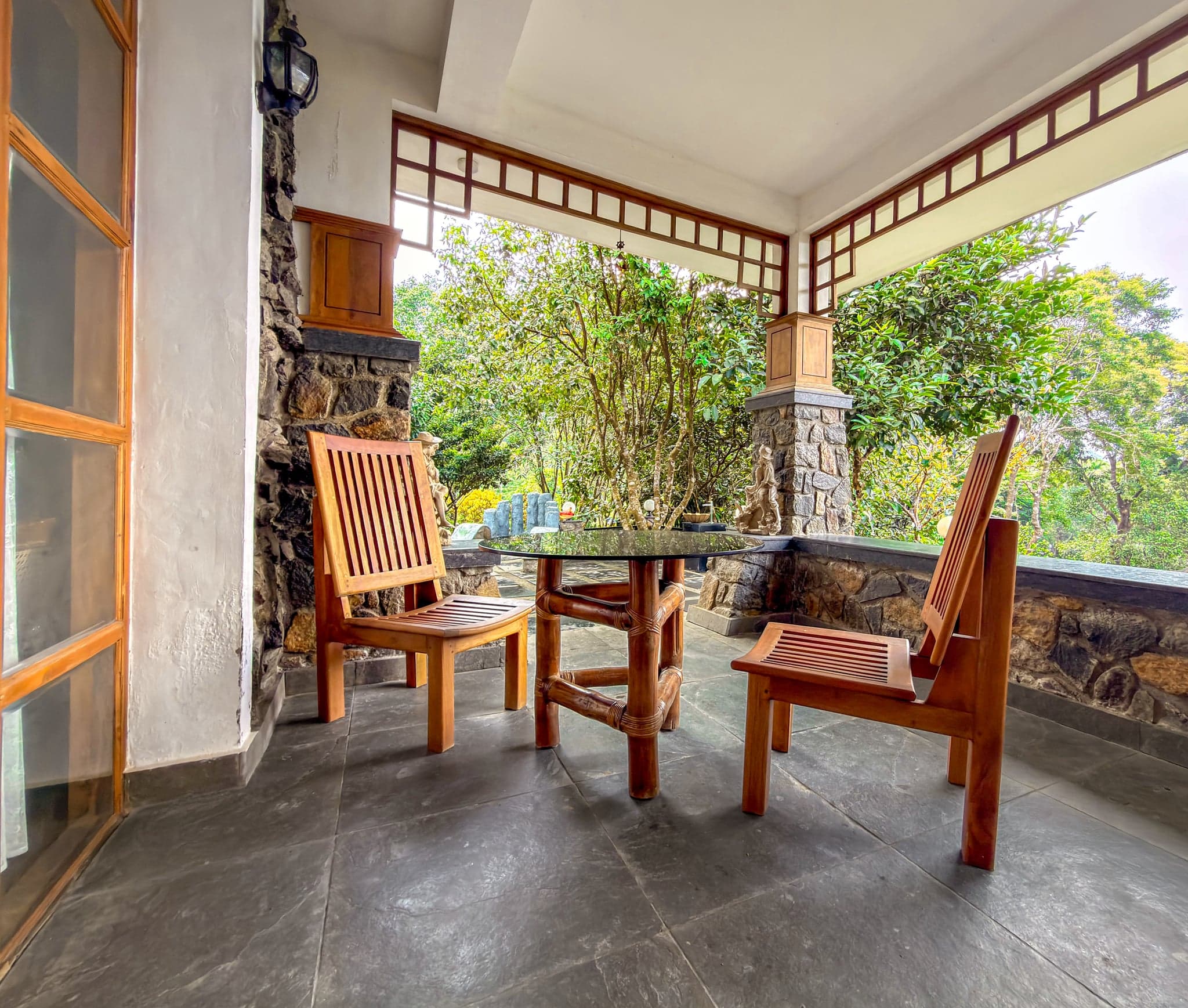 Verandah seating with hill views at The Sanctuary by Heyday, Panchalimedu, Idukki, Kerala