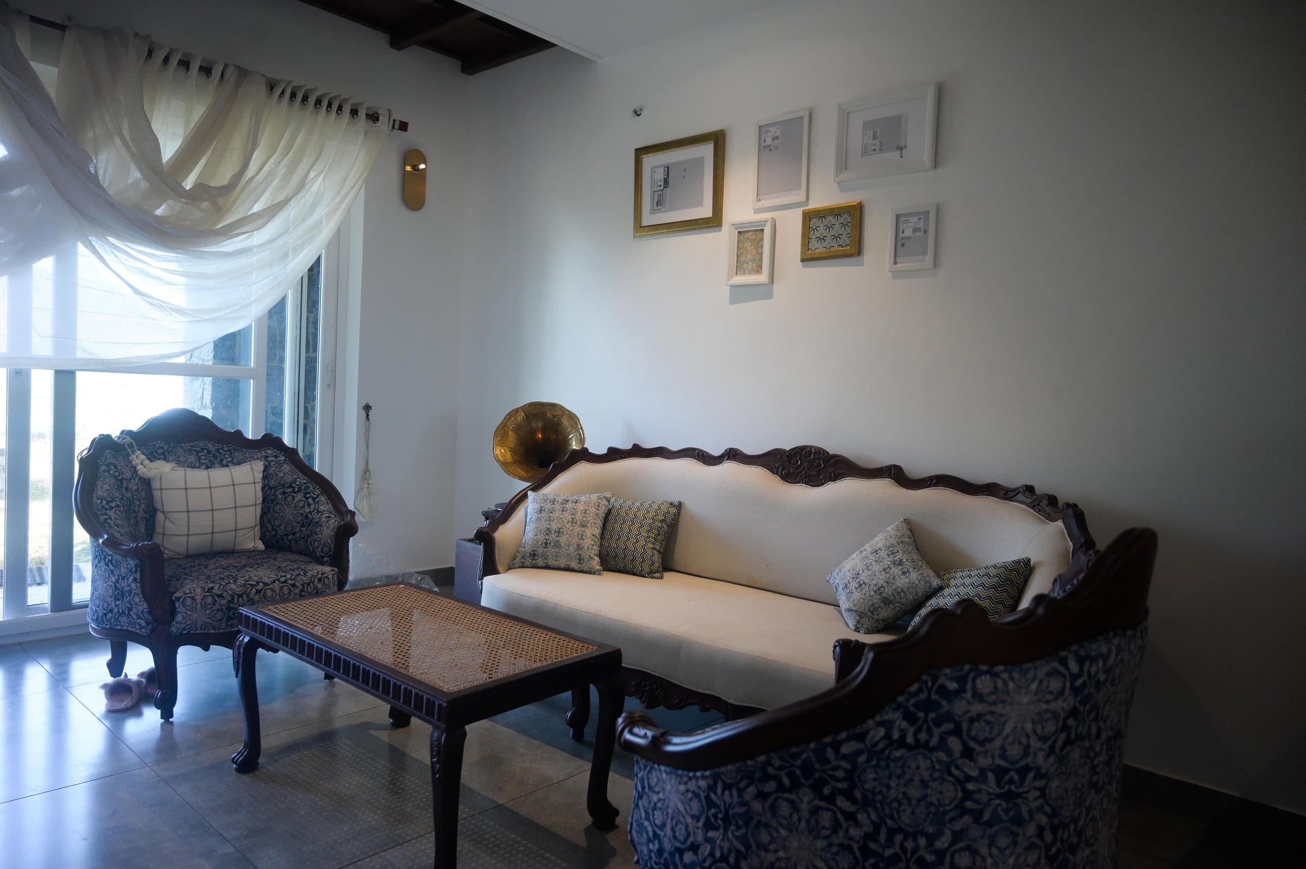 Living room with antique planter-era furniture at Heyday Vagamon, Vagamon, Idukki, Kerala