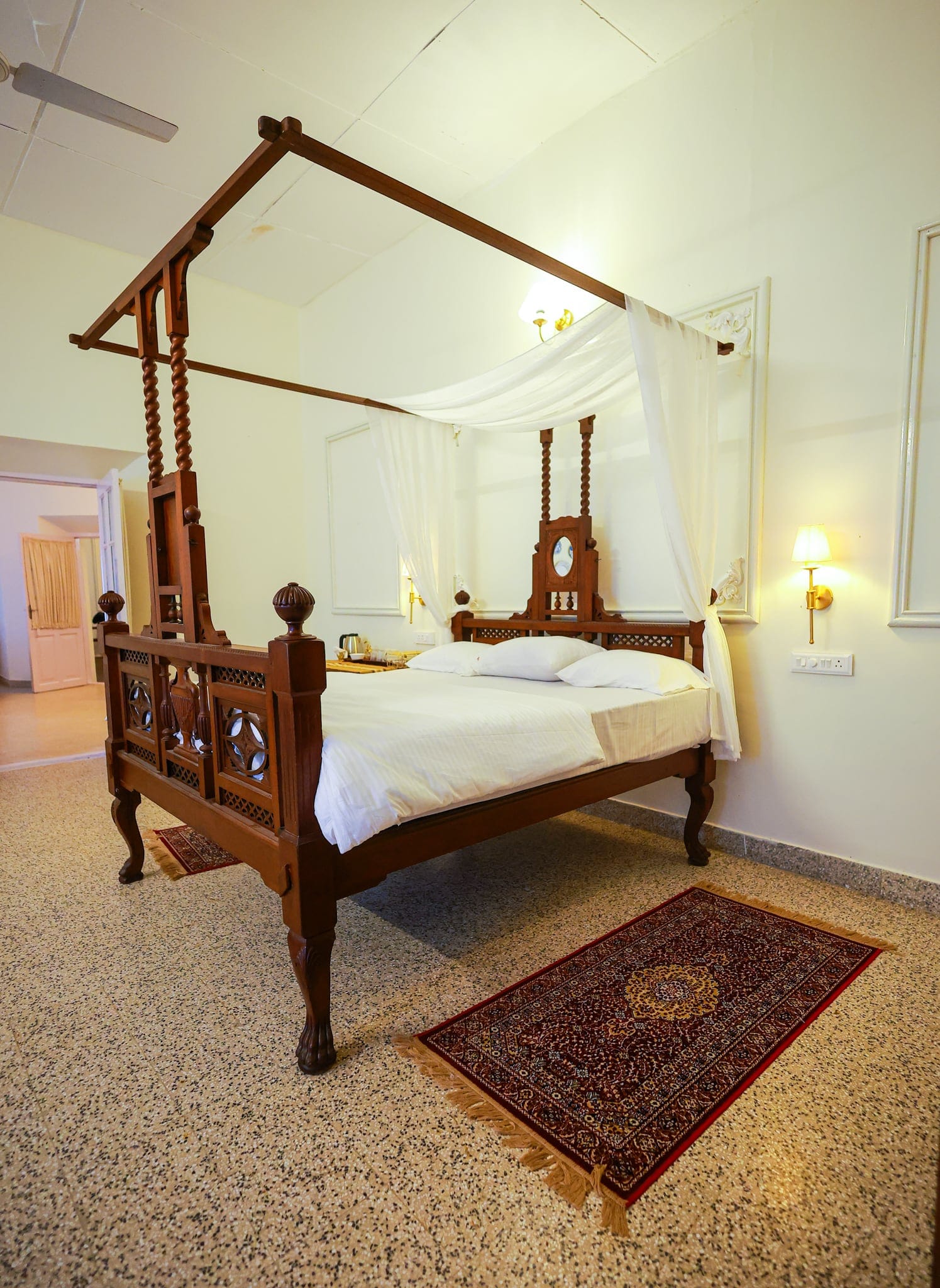 Antique four-poster bed and planter-era furniture at Heyday Planter's Portico, near Thenmala, Kollam, Kerala